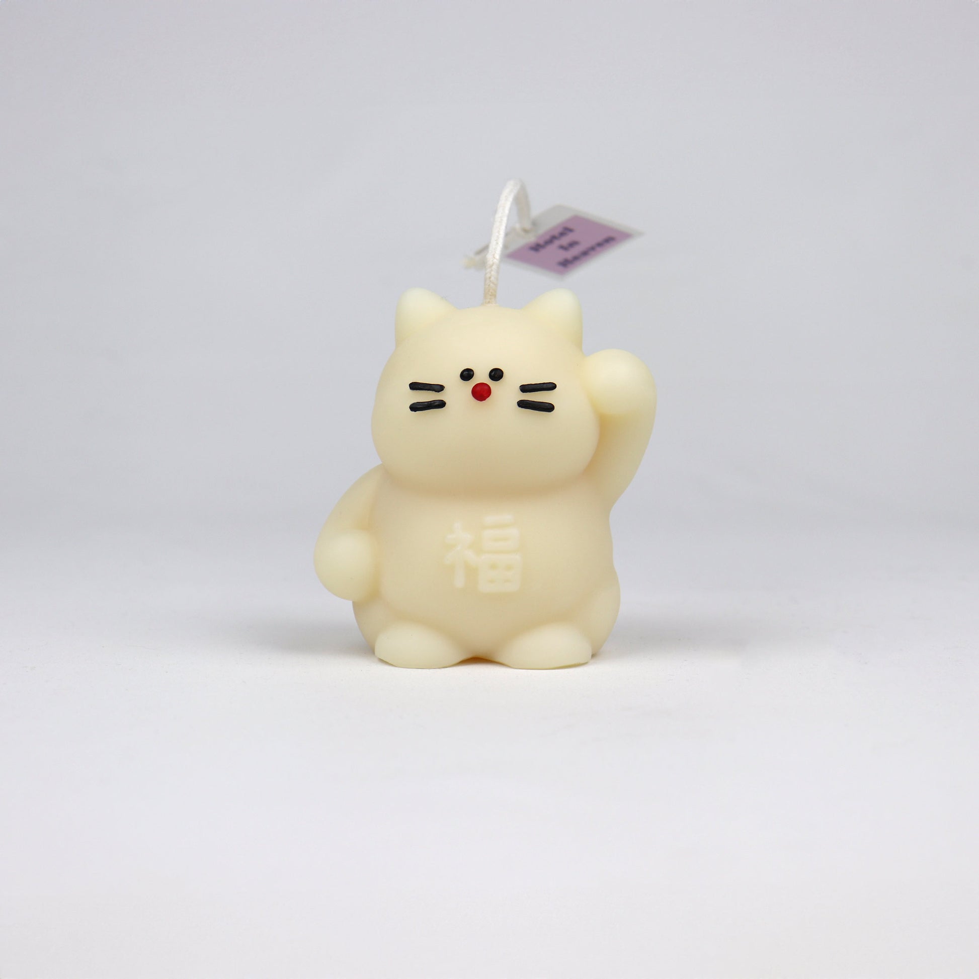 White handmade lucky cat candle with cotton wick, soy-based and scented, made in Brisbane