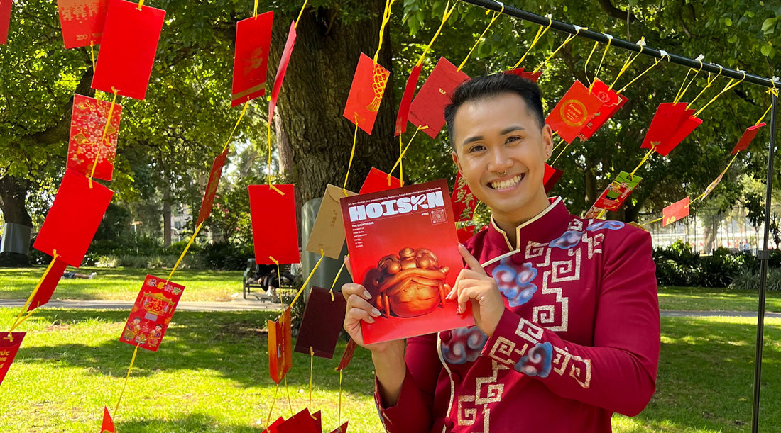 Dan from HOISZN holding issue 002 in traditional Vietnamese ao dai