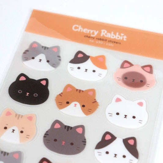 Sticker sheet of cat faces close up