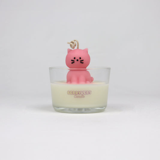 Pink cat-shaped candle sitting in a glass jar, handmade in Brisbane with soy wax and cotton wick.