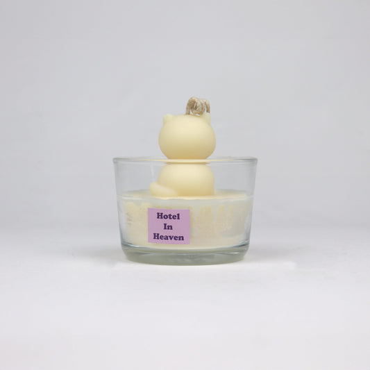 Back of white cat-shaped candle sitting in a clear glass jar, handmade in Brisbane from soy wax with a cotton wick.