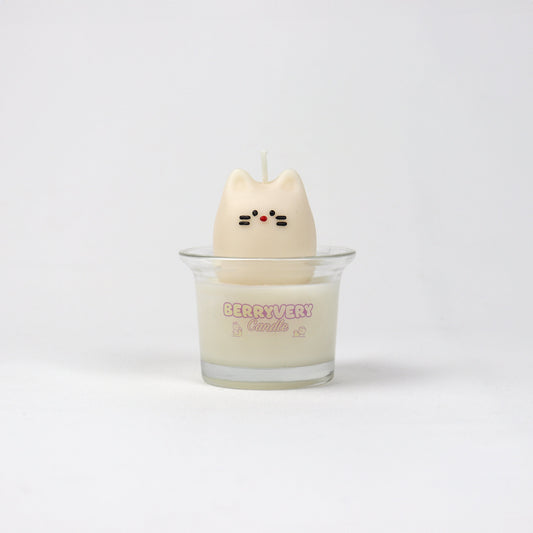 A white mini candle shaped like a cat with a wax layer, possibly for a children's room or as a playful home accessory.